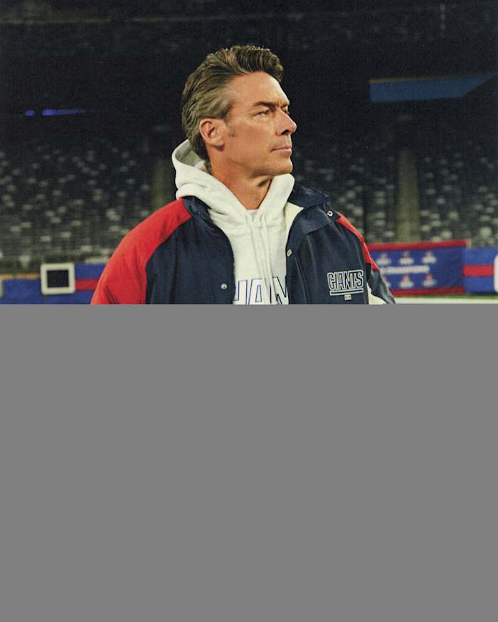 Jason Sehorn models New York Giants apparel.